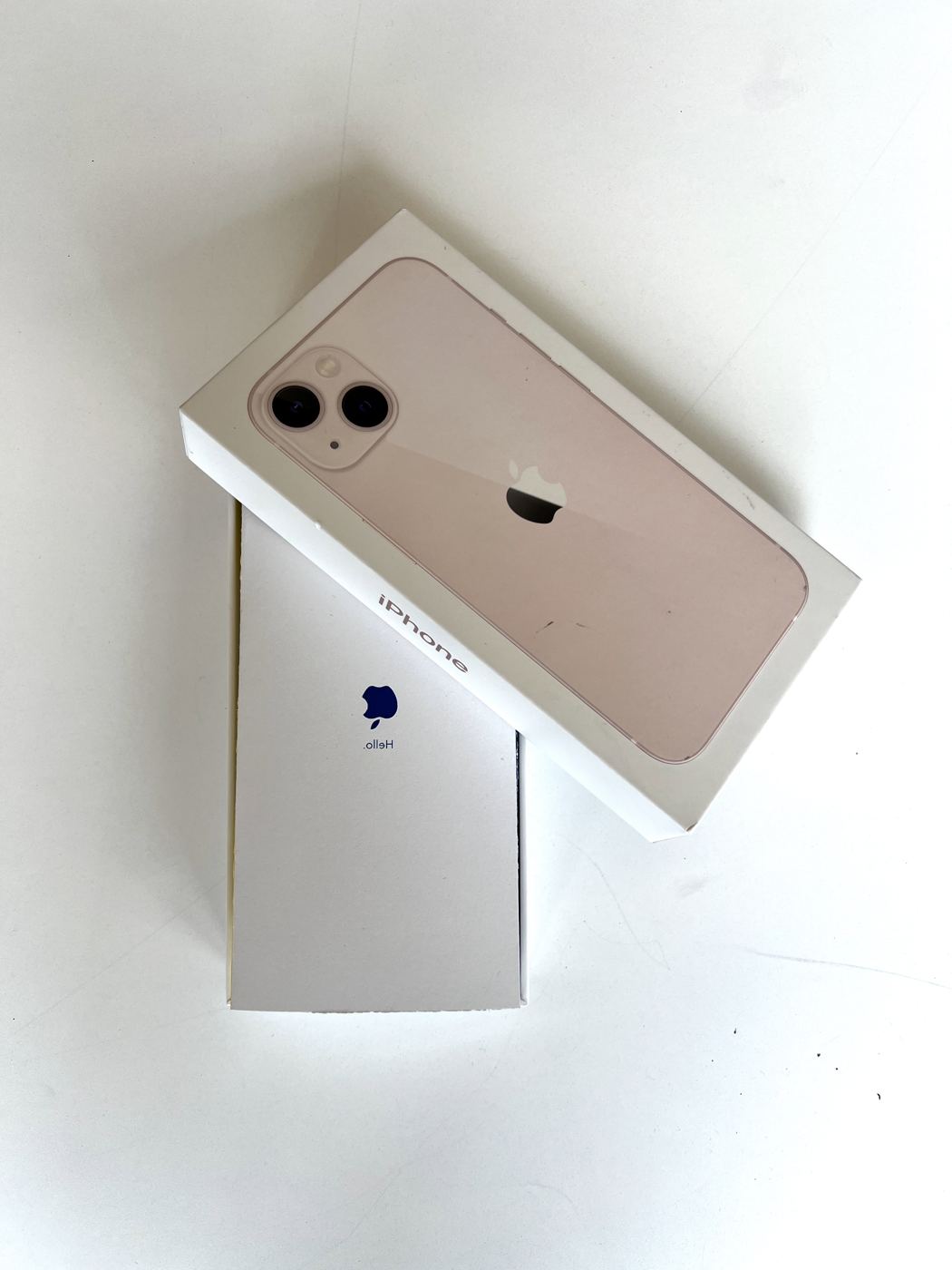 The iPhone box with the folded manual slipped underneath